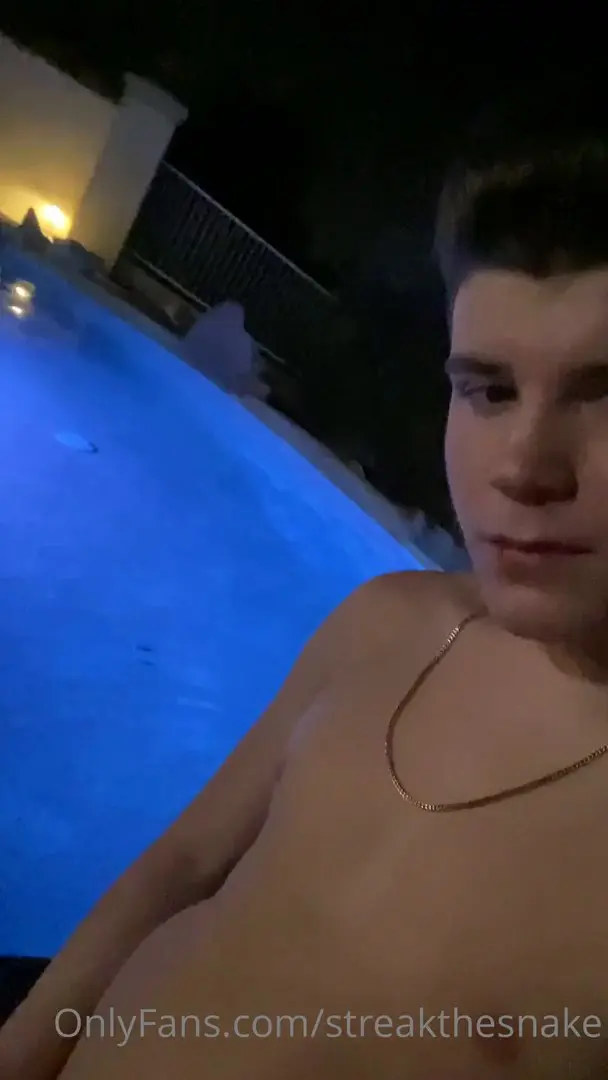 streakthesnake showing his soft cock next to a swimming pool