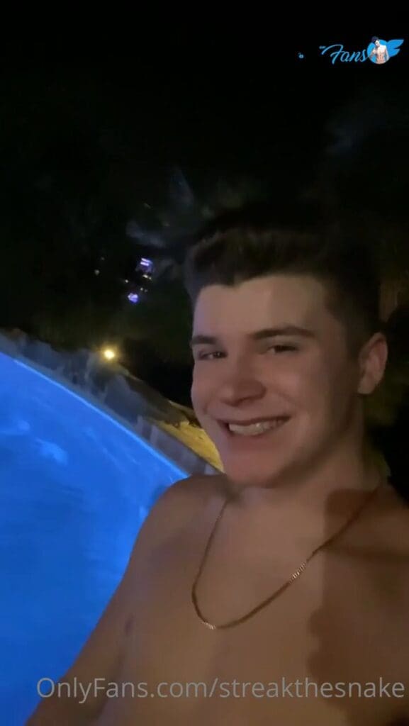 streakthesnake showing his soft cock next to a swimming pool